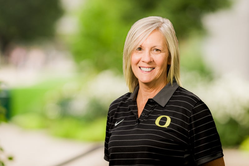 Patty Smith wearing a black polo shirt