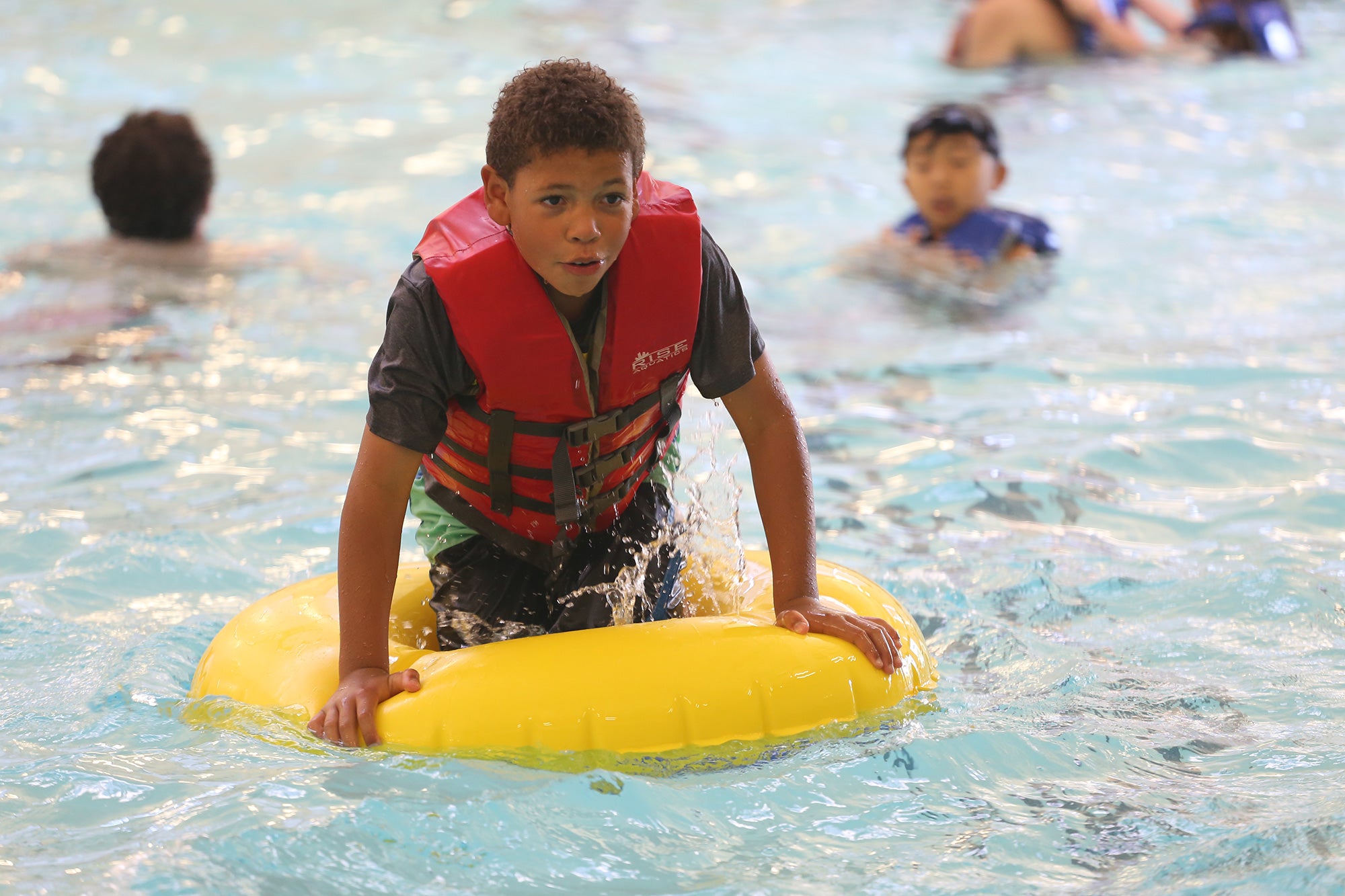 Dominic Turner on an inner-tube in Downtown Aquatics Dominic Turner on an inner-tube in Downtown Aquatics